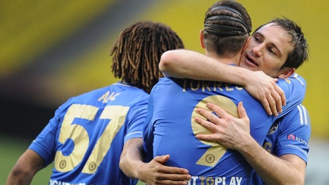 Torres is congratulated by Lampard after scoring the opener for Chelsea.