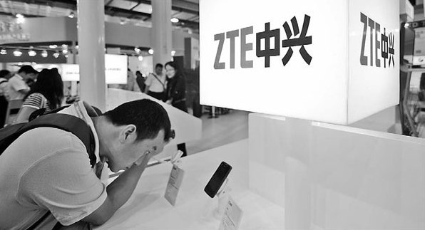 ZTE's mobile phone display at a telecommunications trade show in Beijing. The company booked a net loss of 2.84 billion yuan ($459 million) last year, from a net profit of 2.06 billion yuan in 2011.[China Daily]