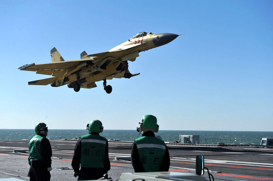 A shipborne fighter jet is about to land on China's Liaoning Aircraft Carrier during a training session on Thursday April 18, 2013. [Photo: CFP]