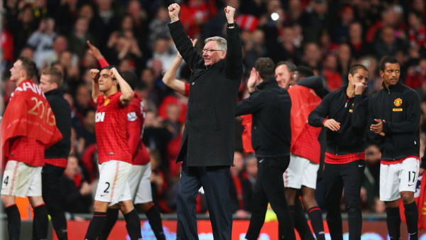 Sir Alex Ferguson raises his arms in celebration after United clinched their 20th title.