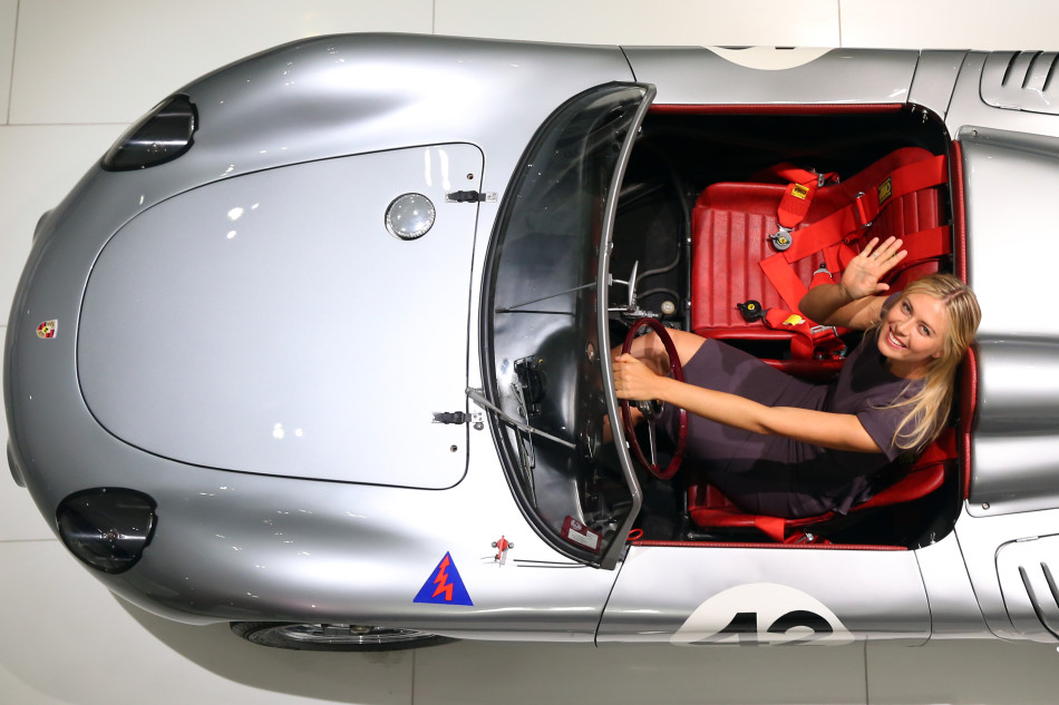 Tennis player Maria Sharapova poses in a Porsche 718 RS 60 Spyder at the Porsche Museum on April 22, 2013 in Stuttgart, Germany. 