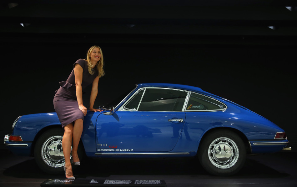 Maria Sharapova sits on a Porsche 911 2.0 Coupe at the Porsche Museum on April 22, 2013 in Stuttgart, Germany