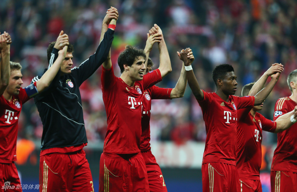 Bayern players celebrate at the end of the game with their fans.