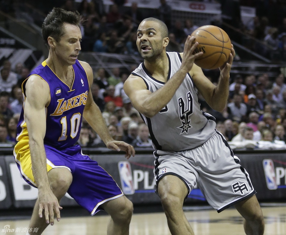 Tony Parker tries to cut in against Steve Nash. 