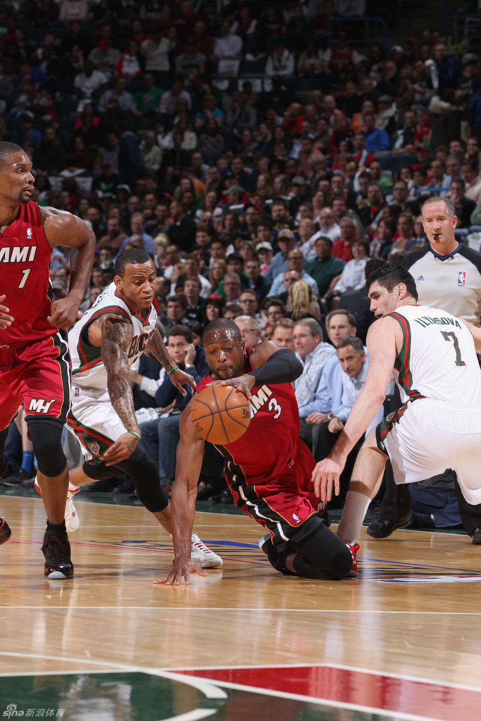 Dwayne Wade and Monta Ellis vie for a loose ball.