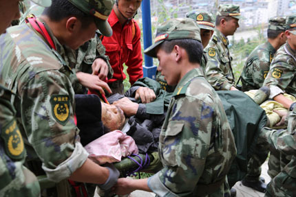 A 78-year-old man is pulled out alive from the debris on Wednesday in Baoxing County in Ya'an City, five days after an earthquake hit the area. The man is the first survivor after the 'golden rescue time,' or the immediate 72 hours after the quake, the local government said yesterday. He was found on a hill top at Muping Township. He is in stable condition despite rib fractures.