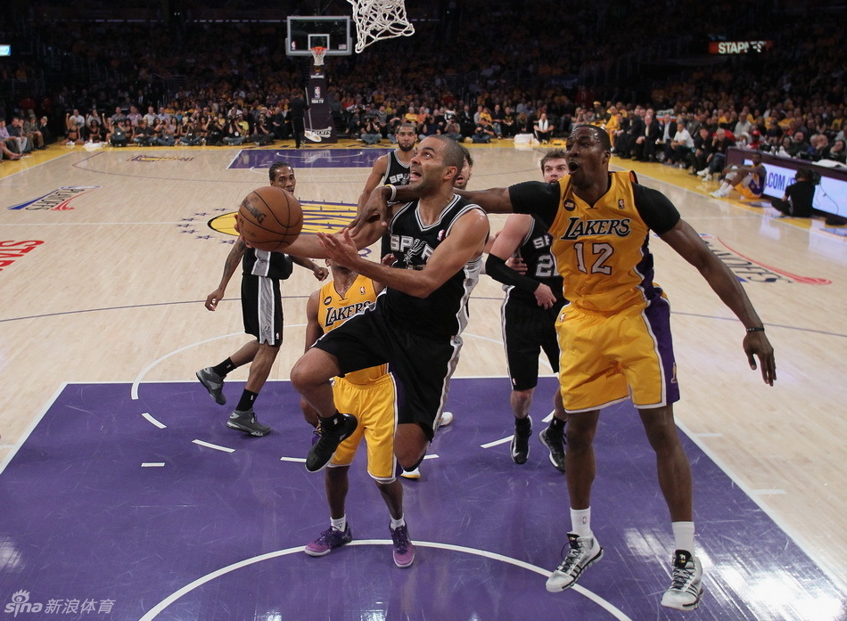 Tony Parker fouled by Dwight Howard when going up for a basket. 
