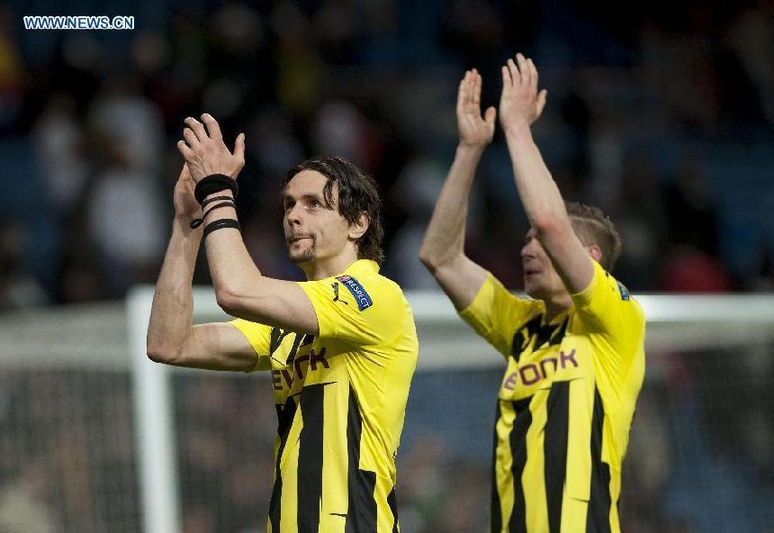 Borussian Dortmund&apos;s players celebrate after the UEFA Champions League semi-final against Real Madrid in Madrid, capital of Spain, April 30, 2013. Borussia Dortmund qualified for the Champions League final, beating Real Madrid 4-3 on aggregate despite a 2-0 loss Tuesday. (Xinhua/Xie Haining)