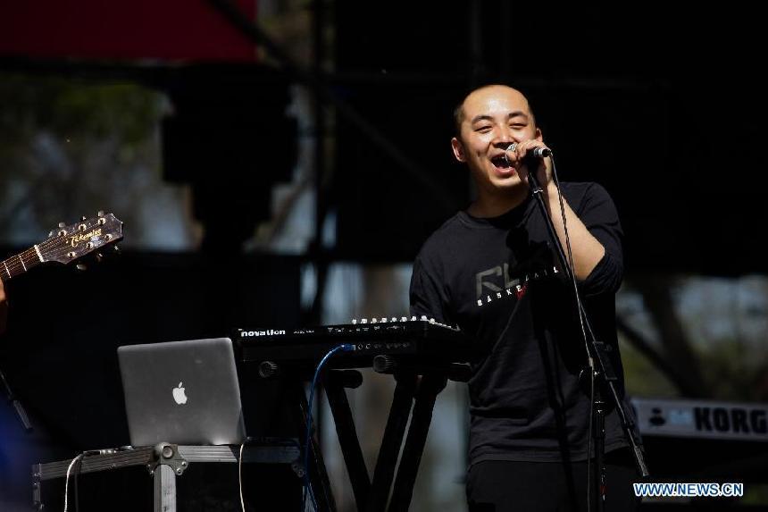 Singer Wang Dazhi performs at the 5th Strawberry Music Festival at the Tongzhou Canal Park in Beijing, capital of China, April 30, 2013. The three-day festival kicked off here on April 29, involving some 160 performing teams from at home and abroad. (Xinhua/Bi Xiaoyang)