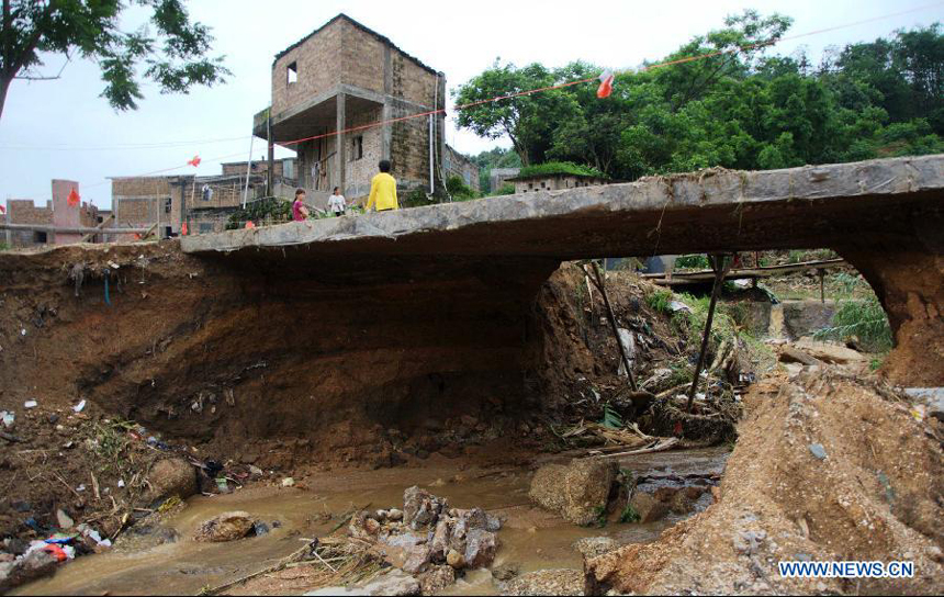 A bridge is seen dilapidated after floods at Juntian Village in Bobai County, south China&apos;s Guangxi Zhuang Autonomous Region, May 1, 2013. Floods and landslides triggered by heavy rain have claimed five lives while affecting more than 200,000 people in Guangxi.