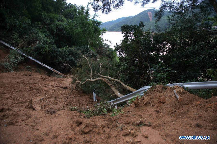 A section of road is damaged by mud-rock flow in Bobai County, south China&apos;s Guangxi Zhuang Autonomous Region, May 1, 2013. Floods and landslides triggered by heavy rain have claimed five lives while affecting more than 200,000 people in Guangxi.