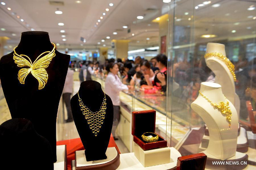 Gold accessories are on sale in Caibai, one of best-known gold retailers in Beijing, China, May 2, 2013. Sales of gold reached 200 million RMB (32.44 million U.S. dollars), up 30 percent year on year during the three-day May Day holiday at Caibai due to recent abrupt price drop for the precious metal.