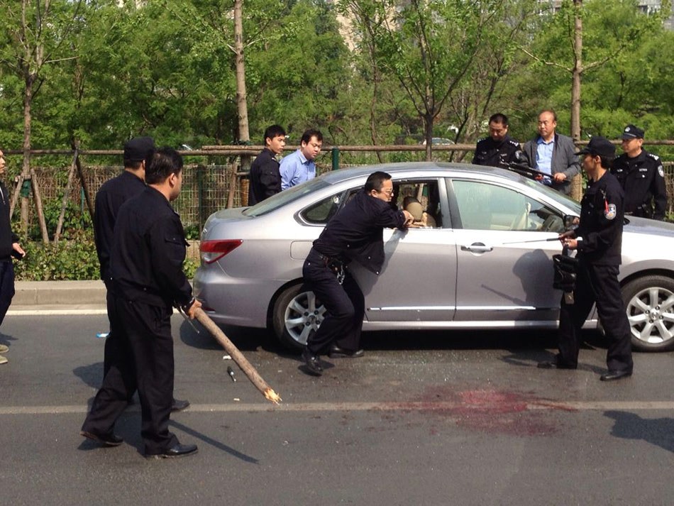 An attacker who stabbed two people to death and injured another in downtown Beijing on Saturday has been named as Li Jinghui, local police said Monday.