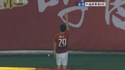 A TV grab of a China Central Television (CCTV) shows Gao raised his right hand to the team's fans after scoring a second-half goal.