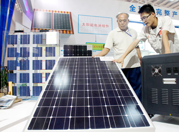 Solar panels on display at an expo in Haikou, Hainan province. A Ministry of Commerce official said the European Commission has been using the solar panel case as a bargaining chip to seek compromise from China in specific sectors, such as telecoms. [China Daily]