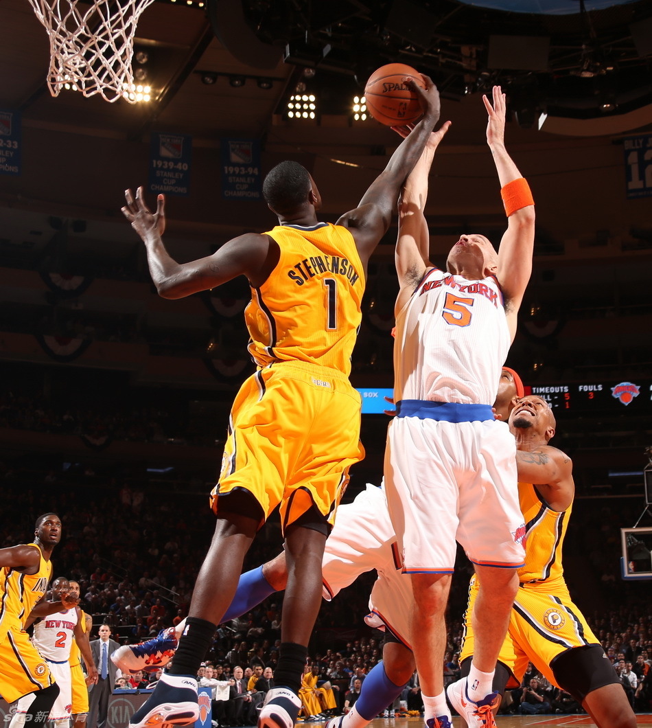 Stephenson and Kidd jump for the rebound. 