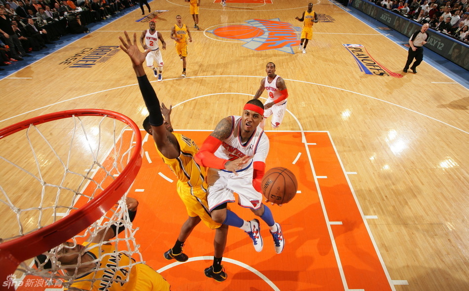 Anthony goes up for a basket against defender.