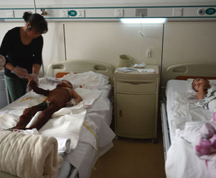 Brothers burned by boy while copying TV scene