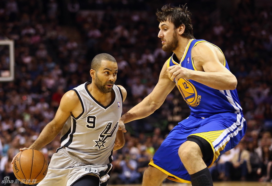 Tony Parker tries to drive past Bogut. 