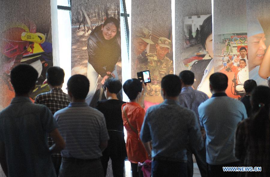 People visit the Wenchuan Earthquake Memorial Museum in the town of Qushan, Beichuan Qiang Autonomous County, southwest China's Sichuan Province, May 9, 2013.