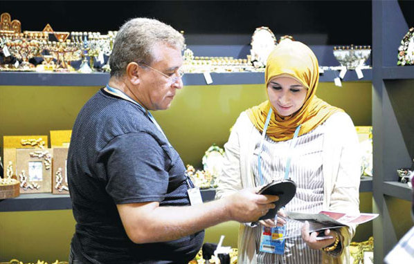 Buyers at the 113th China Import and Export Fair (Canton Fair) in Guangzhou in May. According to statistics from the fair, orders from the BRICS member nations of India, Brazil, Russia and South Africa increased by 5.2 percent year-on-year, while those from countries in the Middle East increased by 3.8 percent. [China Daily]