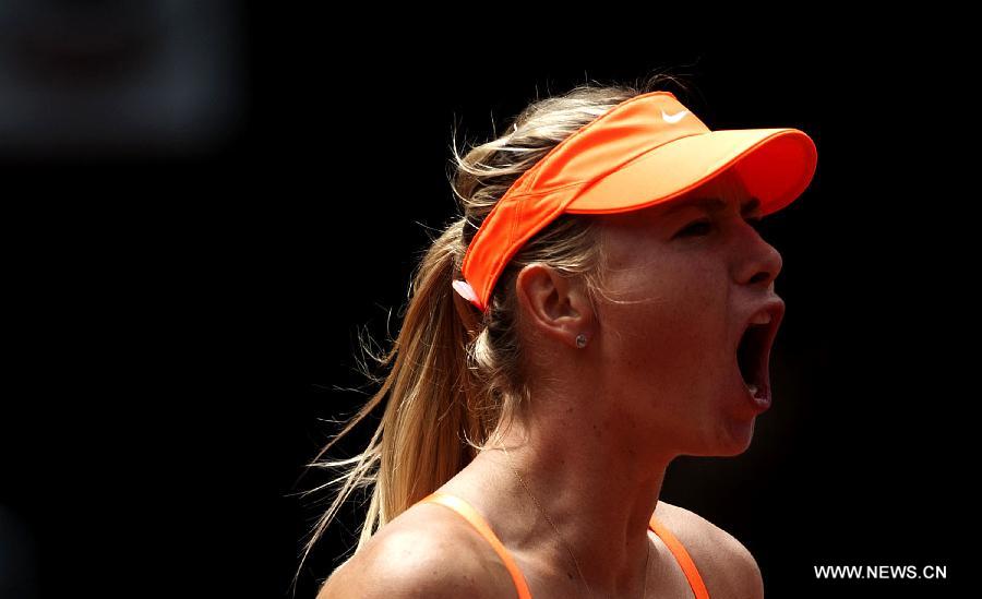 Maria Sharapova of Russia reacts after the women&apos;s 3rd round match against Sabine Lisicki of Germany at the Madrid Tennis Open in Madrid, Spain, on May 9, 2013. Maria Sharapova won 2-0. 