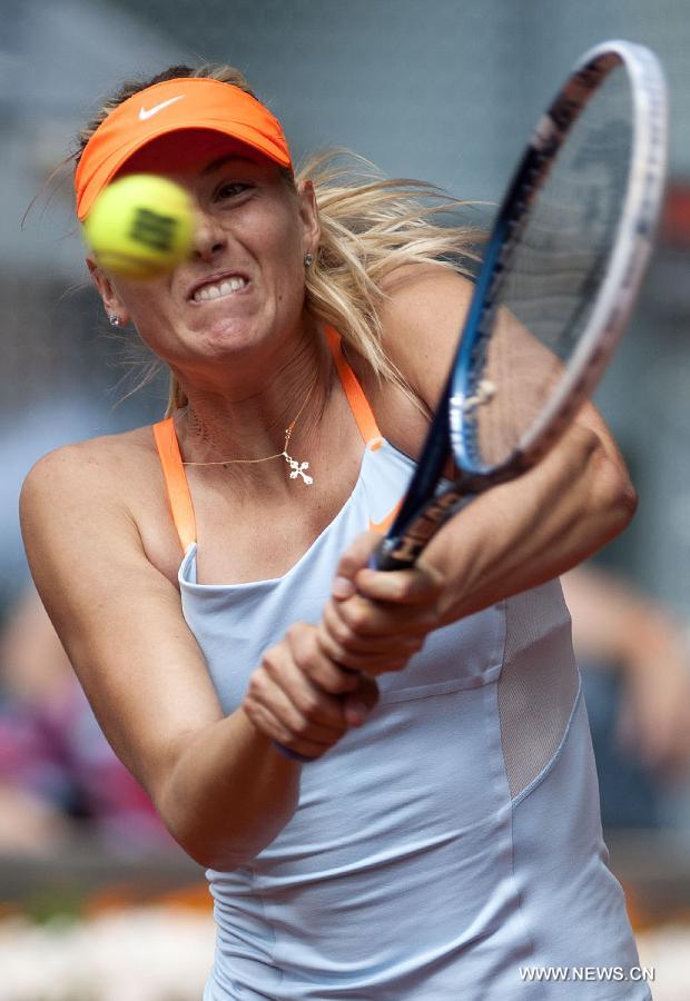 Maria Sharapova of Russia returns the ball during the women&apos;s 3rd round match against Sabine Lisicki of Germany at the Madrid Tennis Open in Madrid, Spain, on May 9, 2013. Maria Sharapova won 2-0.