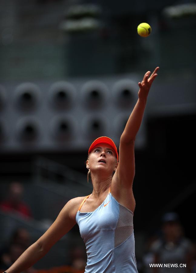 Maria Sharapova of Russia serves during her women&apos;s 3rd round match against Sabine Lisicki of Germany in the Madrid Tennis Open in Madrid, Spain, on May 9, 2013. Sharapova won 2-0.