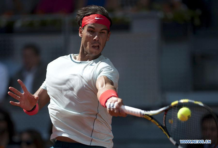 Rafael Nadal of Spain returns the ball during his men&apos;s 3rd round match against Mikhail Youzhny of Russia in the Madrid Tennis Open in Madrid, Spain, on May 9, 2013. Rafael Nadal won 2-0.