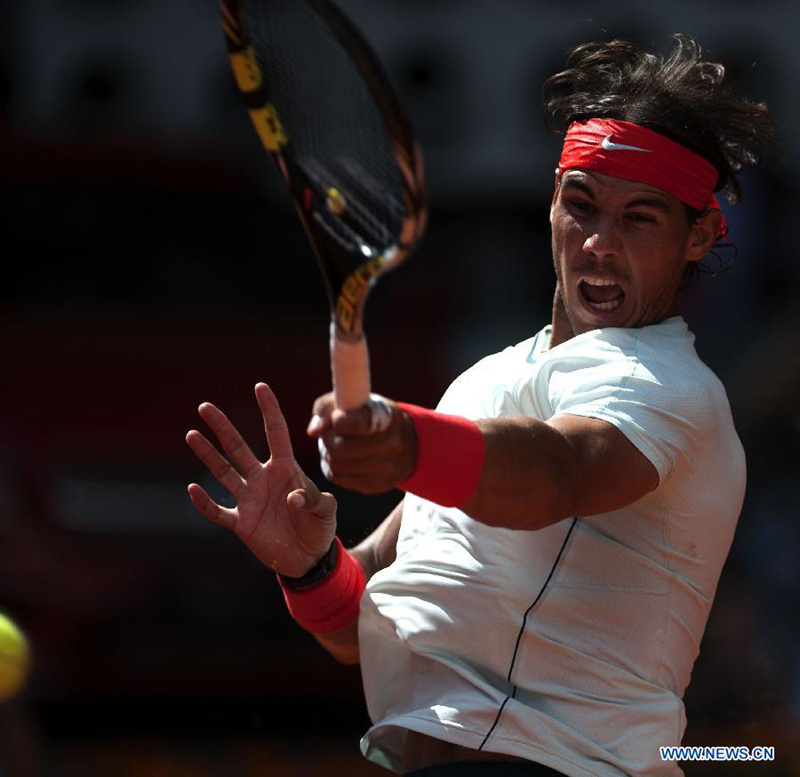 Rafael Nadal of Spain returns the ball during his men&apos;s 3rd round match against Mikhail Youzhny of Russia in the Madrid Tennis Open in Madrid, Spain, on May 9, 2013. Rafael Nadal won 2-0. 