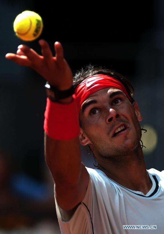 Rafael Nadal of Spain serves the ball during his men&apos;s 3rd round match against Mikhail Youzhny of Russia in the Madrid Tennis Open in Madrid, Spain, on May 9, 2013. Rafael Nadal won 2-0.