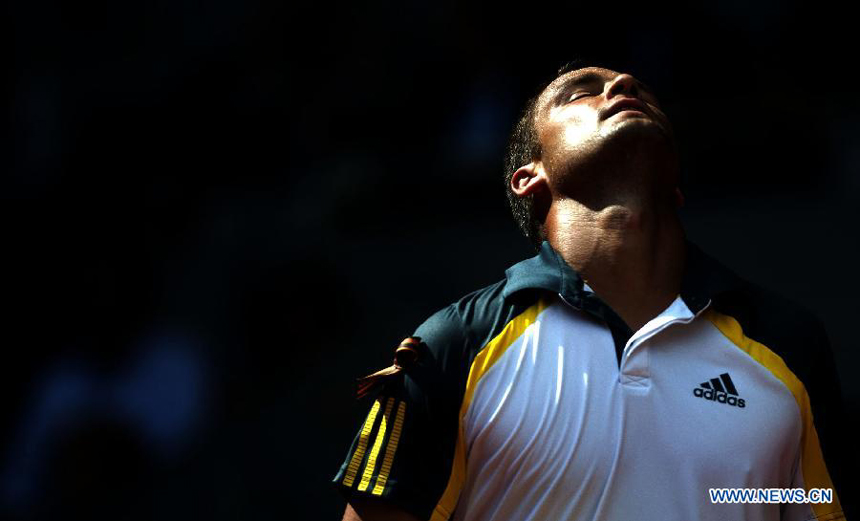 Mikhail Youzhny of Russia reacts during his men&apos;s 3rd round match against Rafael Nadal of Spain in the Madrid Tennis Open in Madrid, Spain, on May 9, 2013. Mikhail Youzhny lost 0-2. 