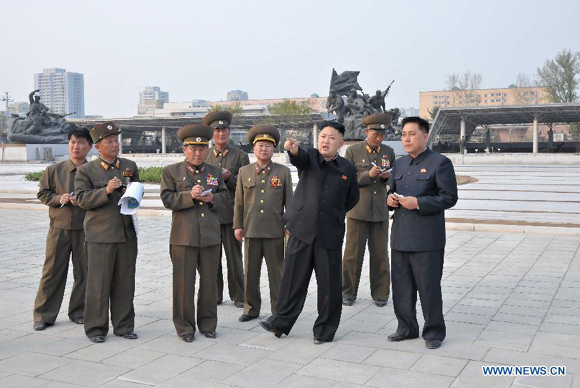 The photo provided by KCNA on May 7, 2013 shows top leader of the Democratic People's Republic of Korea (DPRK) Kim Jong Un (3rd R) inspecting construction projects built by Korean People's Army on May 6, 2013. 