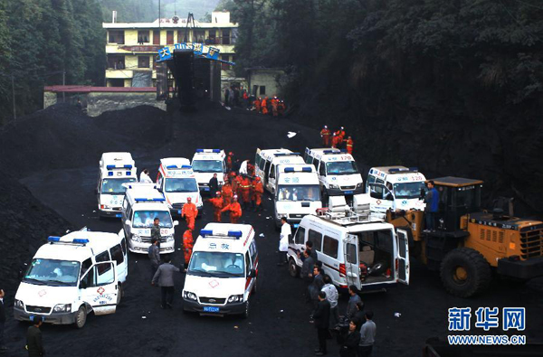 Rescuers work at the Dashan coal mine where a colliery gas explosion occurred in Pingba County, southwest China's Guizhou Province, May 11, 2013. Twelve people were killed and two others injured in the explosion on the evening of May 10. 