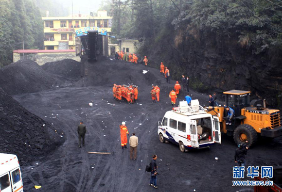 Rescuers work at the Dashan coal mine where a colliery gas explosion occurred in Pingba County, southwest China's Guizhou Province, May 11, 2013. Twelve people were killed and two others injured in the explosion on the evening of May 10. 