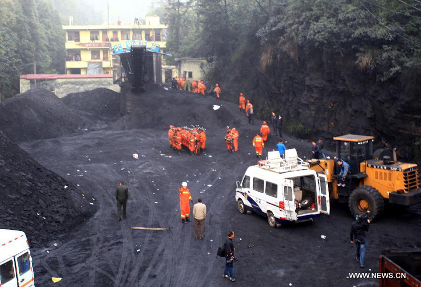 Rescuers work at the Dashan coal mine where a colliery gas explosion occurred in Pingba County, southwest China&apos;s Guizhou Province, May 11, 2013. Twelve people were killed and two others injured in the explosion on the evening of May 10.