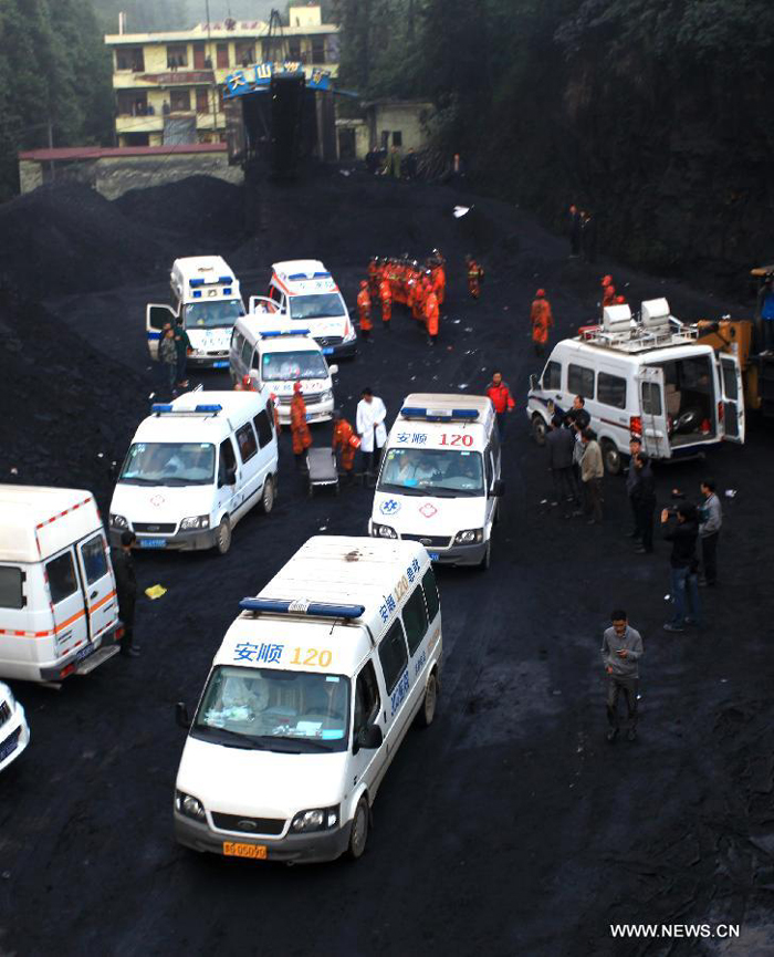 Rescuers work at the Dashan coal mine where a colliery gas explosion occurred in Pingba County, southwest China&apos;s Guizhou Province, May 11, 2013. Twelve people were killed and two others injured in the explosion on the evening of May 10.