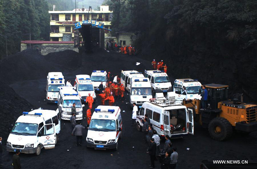 Rescuers work at the Dashan coal mine where a colliery gas explosion occurred in Pingba County, southwest China&apos;s Guizhou Province, May 11, 2013. Twelve people were killed and two others injured in the explosion on the evening of May 10.