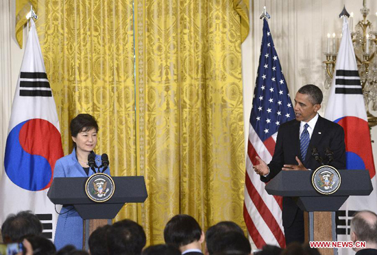 U.S. President Barack Obama (R) and visiting South Korean President Park Geun-hye attend a joint press conferece after their meetings in the East Room of the White House in Washington D.C., capital of the United States, May 7, 2013. [Xinhua]