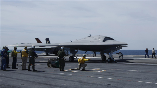 An X-47B pilot-less drone combat aircraft is launched for the first time off an aircraft carrier, the USS George H. W. Bush, in the Atlantic Ocean off the coast of Virginia, May 14, 2013.