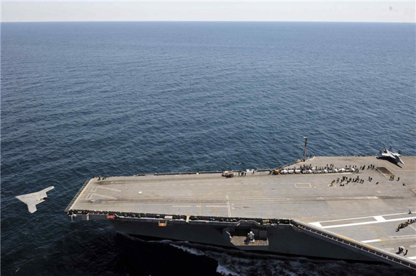 An X-47B Unmanned Combat Air System (UCAS) demonstrator launches from the flight deck of the aircraft carrier USS George H.W. Bush in this US Navy handout photo taken off the coast of Virginia May 14, 2013.