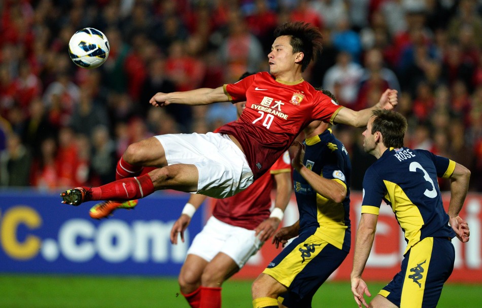 Gao Lin throws himself into air to strike the ball. 