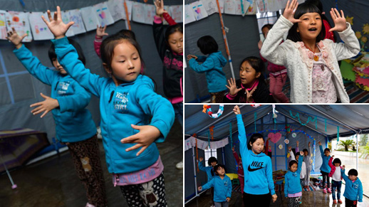 Kids take dance class in tents in Lushan