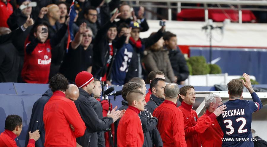 Paris Saint-Germain's English midfielder David Beckham (1st R) waves to the supporters after he is substituted during a French League 1 football match between Paris St Germain and Brest at Parc des Princes stadium in Paris on May 18, 2013. [Wang Lili/Xinhua]