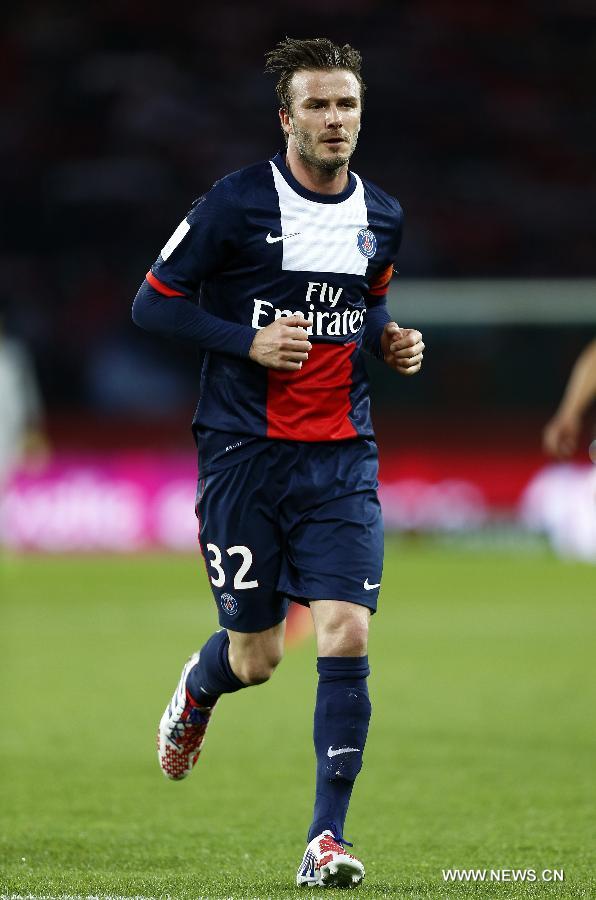 Paris Saint-Germain's English midfielder David Beckham runs for a corner during the French League 1 football match between Paris St Germain and Brest at Parc des Princes stadium in Paris on May 18, 2013. [Wang Lili/Xinhua]