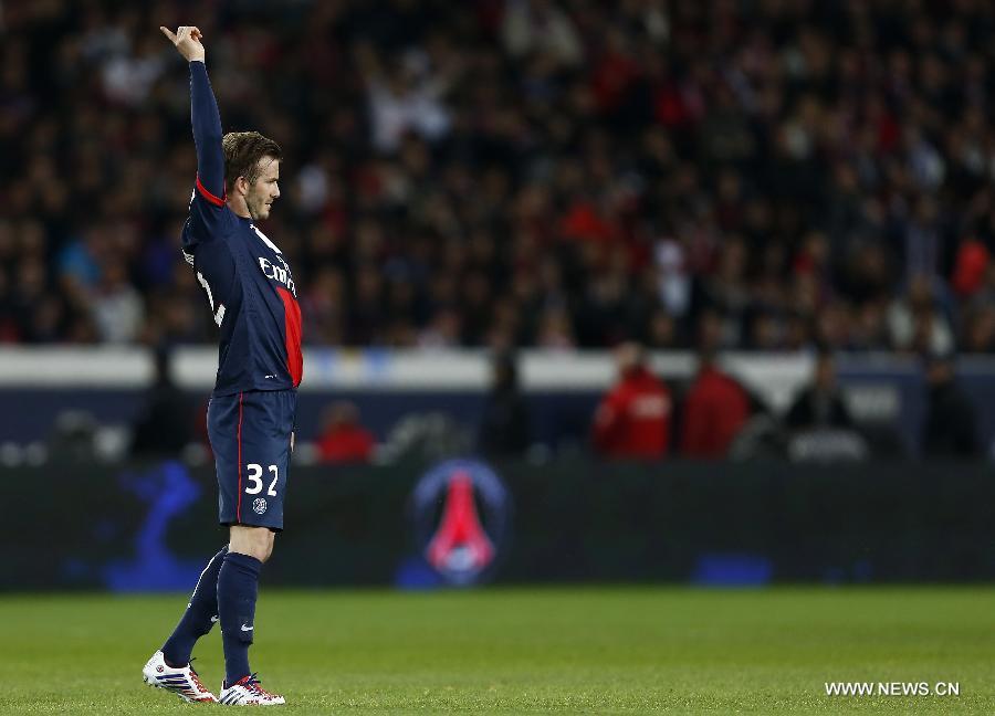 Paris Saint-Germain's English midfielder David Beckham reacts during the French League 1 football match between Paris St Germain and Brest at Parc des Princes stadium in Paris on May 18, 2013. [Wang Lili/Xinhua]