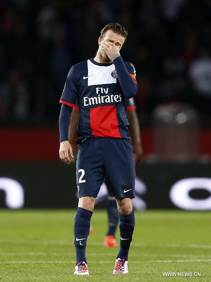 Paris Saint-Germain's English midfielder David Beckham reacts during the French League 1 football match between Paris St Germain and Brest at Parc des Princes stadium in Paris on May 18, 2013. [Wang Lili/Xinhua]