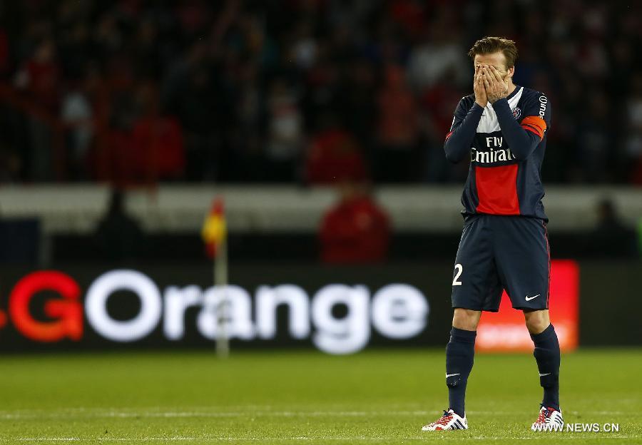 Paris Saint-Germain's English midfielder David Beckham reacts during the French League 1 football match between Paris St Germain and Brest at Parc des Princes stadium in Paris on May 18, 2013. [Wang Lili/Xinhua]