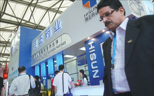 Zhejiang Hisun Pharmaceutical Co's pavilion at a fair in Beijing. By setting up a joint venture with US-based Pfizer Inc in September, Hisun made a breakthrough in China's pharmaceutical industry by taking a controlling stake in the JV with Pfizer, the world's largest drug-maker by sales. [China Daily]