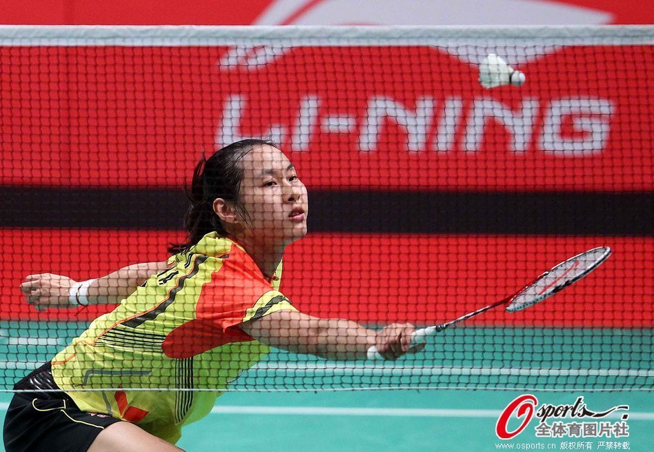 Wang Yihan of China returns a shot against P.V. Sindhu of India during their match at the 2013 Sudirman Cup world team badminton championships in Kuala Lumpur, Malaysia, on May 19, 2013.